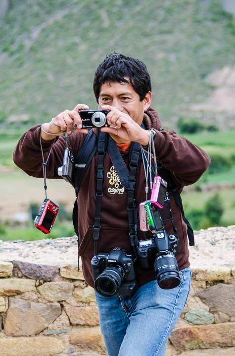 Tourist taking photograph of Machu Picchu - Cusco Region - Peru